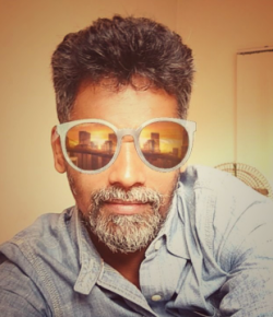 Vinod PM Tamil Associate Director