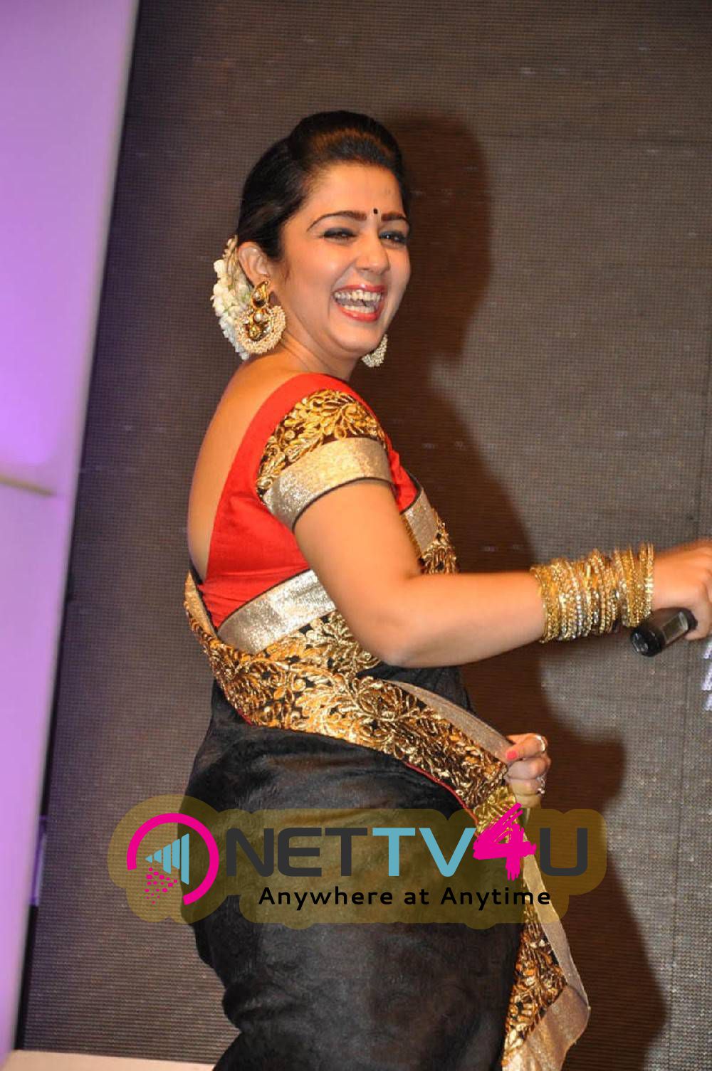 rare pics of actress charmi kaur at jyothi lakshmi movie audio launch 3